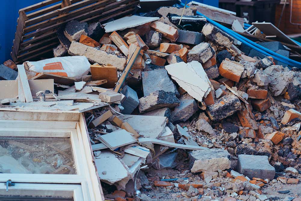 Barry House Clearance rubble in garden